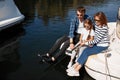 Family with daughter Fishing on yacht sailboat on lake