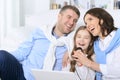 Family with daughter singing karaoke Royalty Free Stock Photo