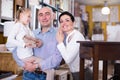 Family with daughter in specialised furniture showroom Royalty Free Stock Photo