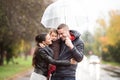 Family with daughter under the umbrellas Walk on rainy day. Royalty Free Stock Photo