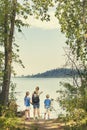 Family on a day hike together near a beautiful mountain lake Royalty Free Stock Photo