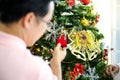 Family decorating a Christmas tree and Father giving Christmas G Royalty Free Stock Photo