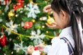 Family decorating a Christmas tree and Father giving Christmas G Royalty Free Stock Photo