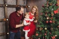 Family decorating christmas tree at home Royalty Free Stock Photo