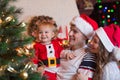 Family decorating Christmas tree in living room Royalty Free Stock Photo