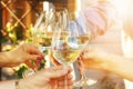 Family of different ages people cheerfully celebrate outdoors with glasses of white wine, proclaim toast Royalty Free Stock Photo