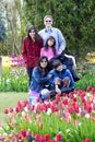 Family with disabled boy in the tulips gardens Royalty Free Stock Photo