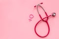Diagnostic and cure of gynaecological disease with stethoscope and female symbol on pink background top view mock-up