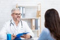 Family doctor visit, health care and decision problems in modern clinic Royalty Free Stock Photo