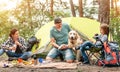 Family with dog during picnic in wood Royalty Free Stock Photo