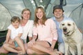 Family with dog in tent Royalty Free Stock Photo