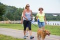 Family and Dog walking for a 5K at creve coure Park St Louis, Mo. Royalty Free Stock Photo