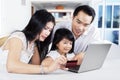 Family doing online shopping at home Royalty Free Stock Photo