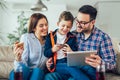 Family doing online shopping with tablet