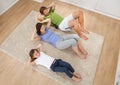 Family Doing Situps On Rug At Home Royalty Free Stock Photo
