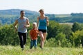 Family doing sports - jogging Royalty Free Stock Photo