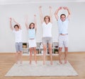 Family Doing Stretching Exercises On The Carpet Royalty Free Stock Photo