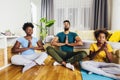 Family doing Yoga at home. Royalty Free Stock Photo