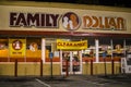 Family Dollar store at night entrance and banner