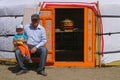 Family at the door of the yurt