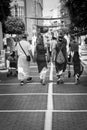 Family dressed as Romans of the imperial era walking through the streets