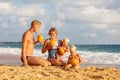 Family drink cocnut at the beach at sunset Royalty Free Stock Photo