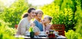 family drinking tea in the garden Royalty Free Stock Photo