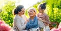 family drinking tea in the garden Royalty Free Stock Photo