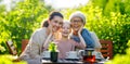 family drinking tea in the garden Royalty Free Stock Photo