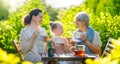 family drinking tea in the garden Royalty Free Stock Photo