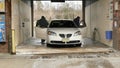 Family Drives in to Self-Serve Car Wash (Winter)