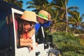 Family driving off-road car on tropical beach Royalty Free Stock Photo