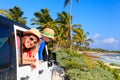 Family driving off-road car on tropical beach Royalty Free Stock Photo