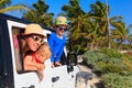 Family driving off-road car on tropical beach Royalty Free Stock Photo