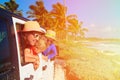 Family driving off-road car on tropical beach Royalty Free Stock Photo