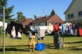 Family drying clothes laundry in backyard Royalty Free Stock Photo