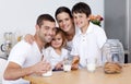 Family eating biscuits and drinking milk Royalty Free Stock Photo