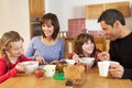 Family Eating Breakfast Together In Kitchen Royalty Free Stock Photo