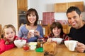 Family Eating Breakfast Together In Kitchen Royalty Free Stock Photo