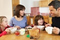 Family Eating Breakfast Together In Kitchen Royalty Free Stock Photo