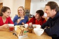 Family Eating Breakfast Together In Kitchen Royalty Free Stock Photo