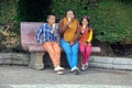 Family eating ice cream on a bench
