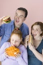 Family Eating Junk Food Royalty Free Stock Photo