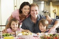 Family Eating Meal Together In Kitchen Royalty Free Stock Photo