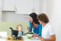 Family eating meat fondue Royalty Free Stock Photo