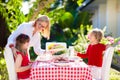 Family eating outdoor. Garden summer fun Royalty Free Stock Photo