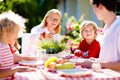 Family eating outdoor. Garden summer fun Royalty Free Stock Photo