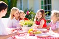 Family eating outdoor. Garden summer fun Royalty Free Stock Photo