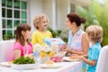 Family eating outdoor. Garden summer fun Royalty Free Stock Photo