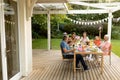 Family eating outside together in summer Royalty Free Stock Photo